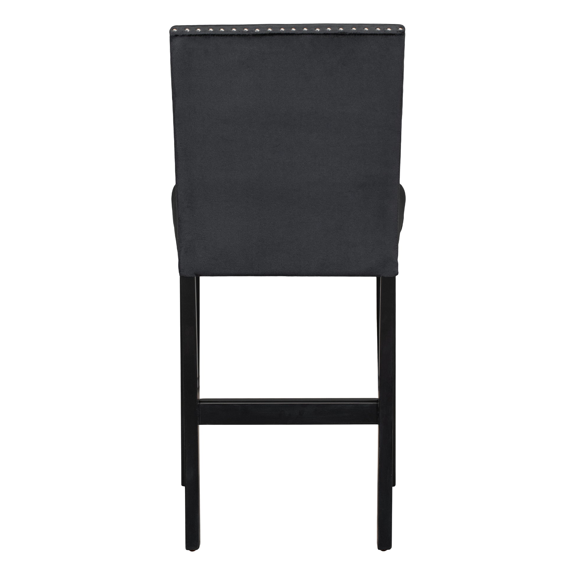 Tufted black velvet bar stool with silver nailhead trim and dark wooden legs