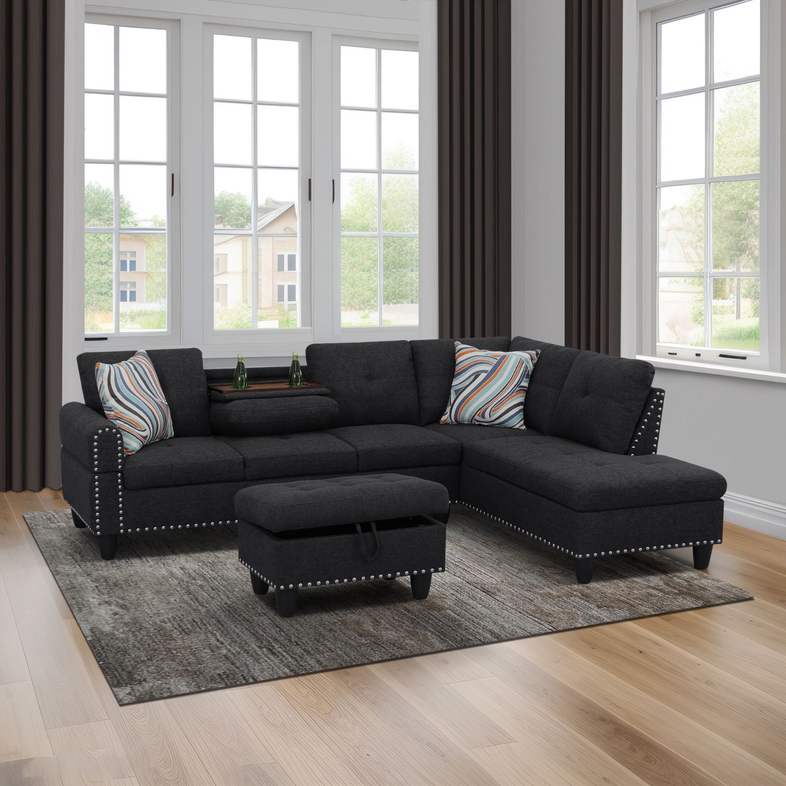 Dark gray sectional sofa with nailhead trim and throw pillows