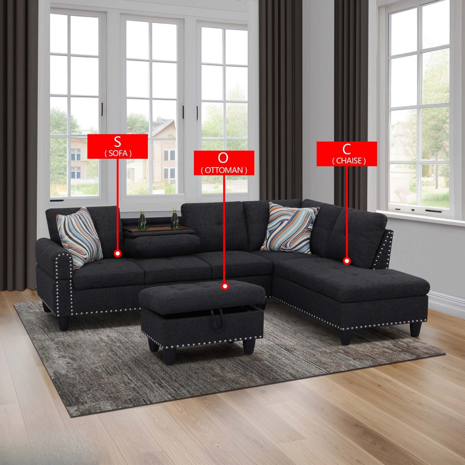 Dark gray sectional sofa with nailhead trim and striped pillows