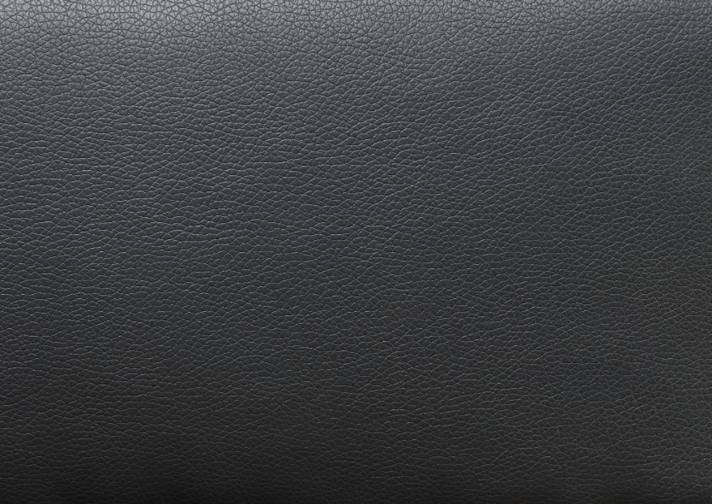 Closeup texture of black vegan leather with fine grain