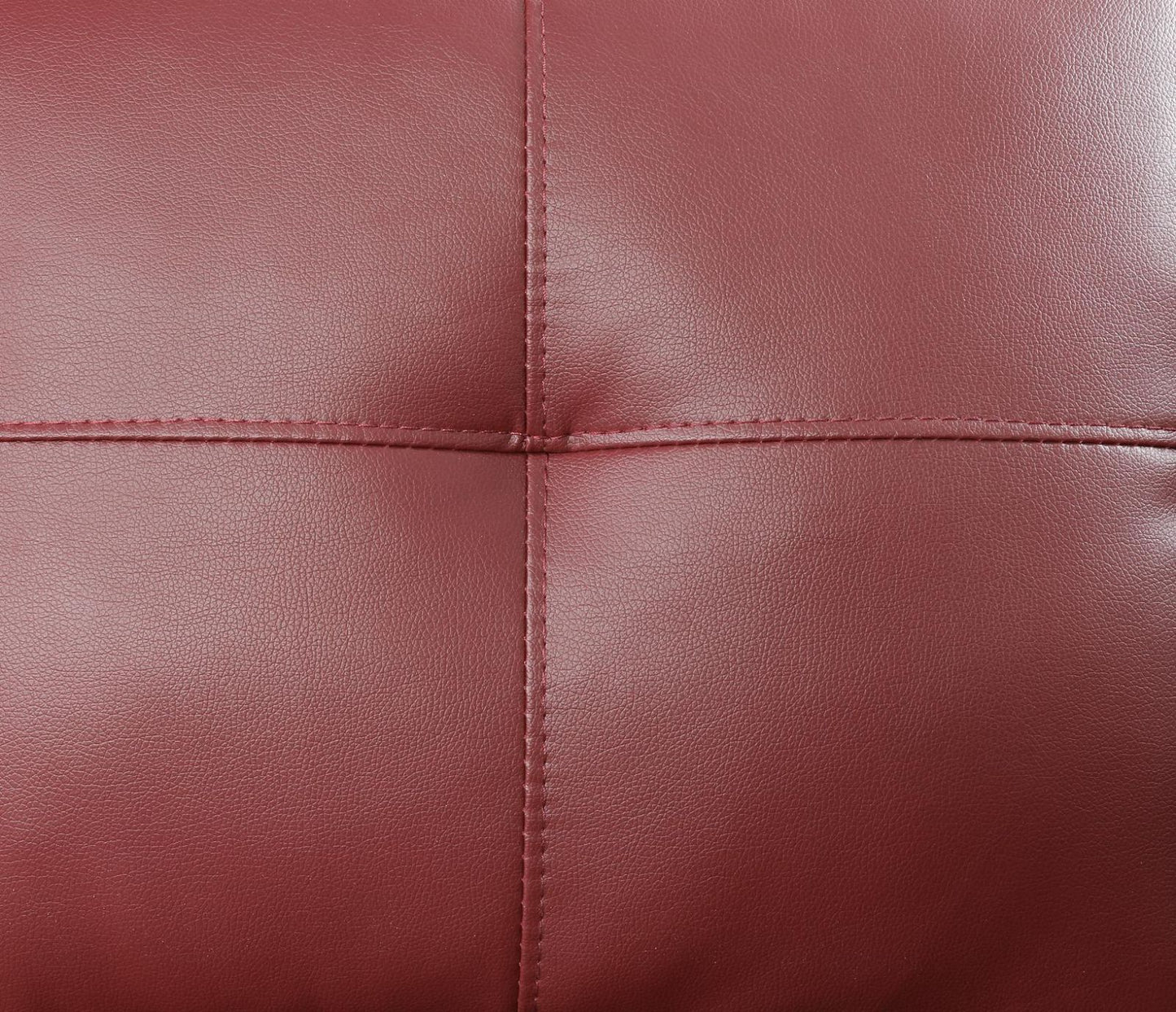 Maroon leather sofa upholstery with tufted stitching detail