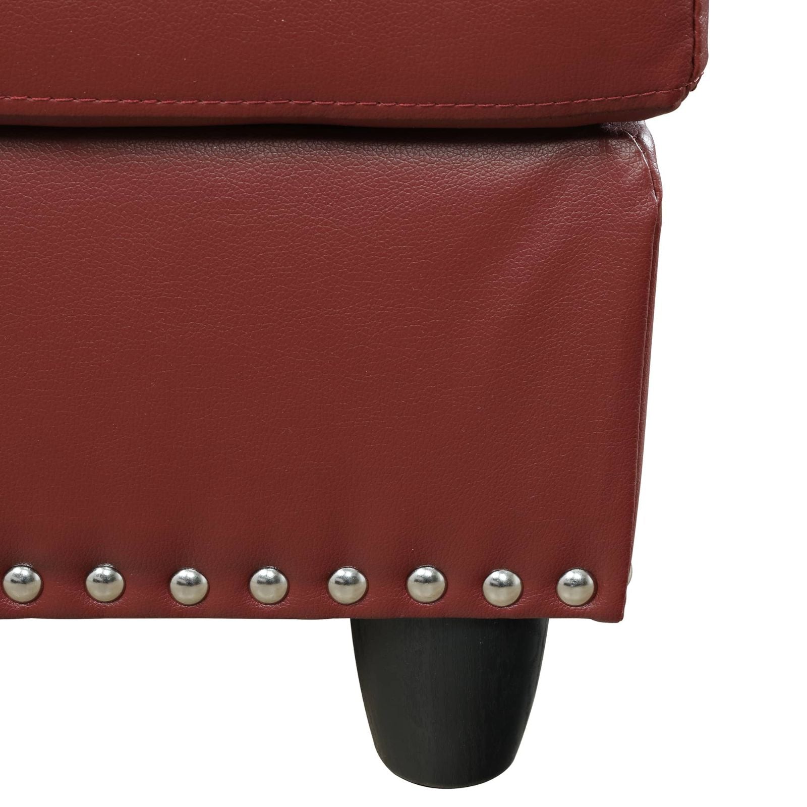 Red leather ottoman with silver decorative studs and black wooden leg modern accent seating furniture