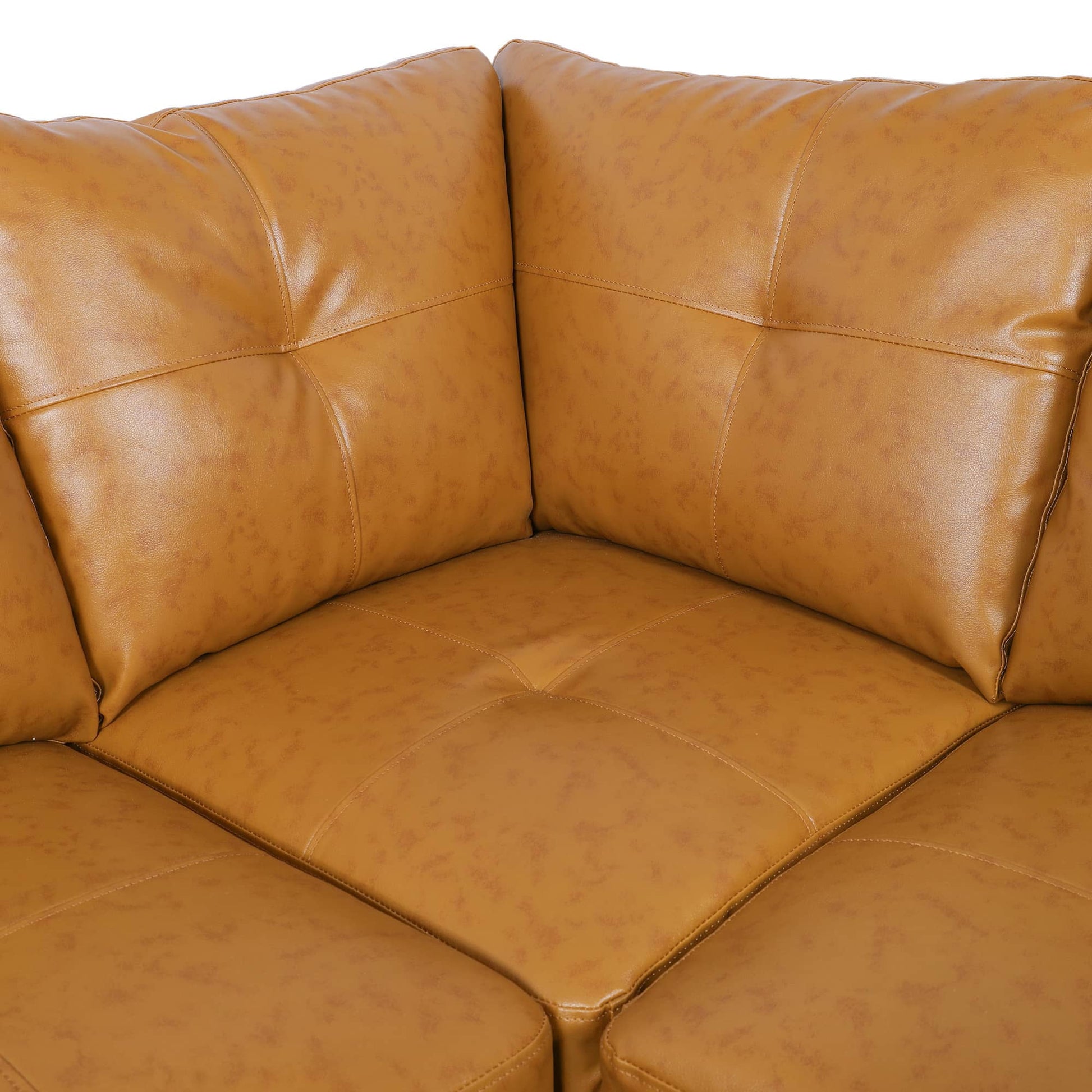Tan leather sofa with tufted cushions for modern living room seating