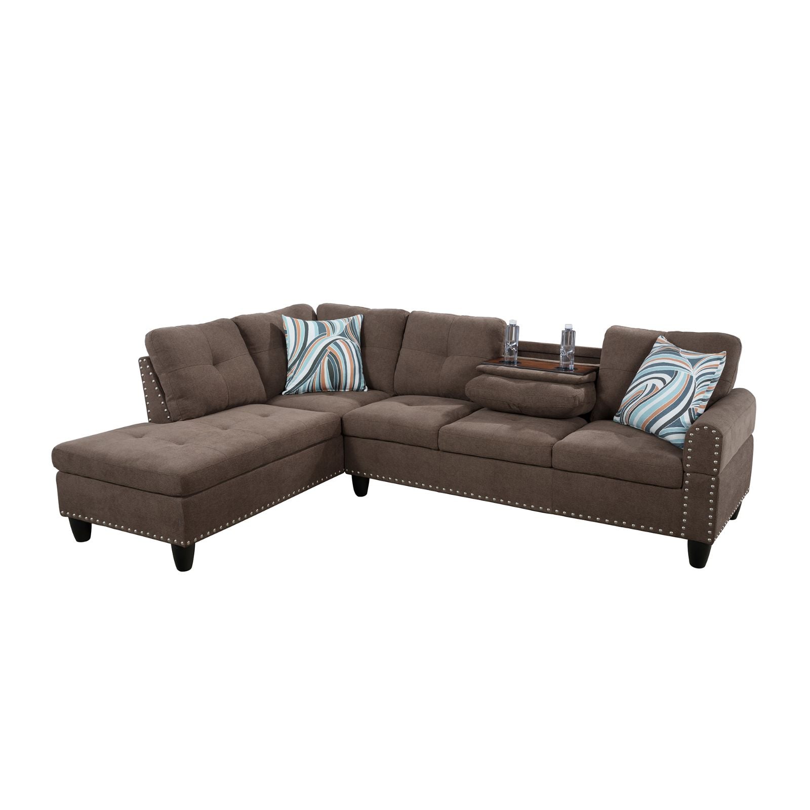 Gray tufted sectional sofa with blue striped pillows and builtin console