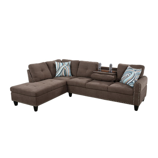 Gray tufted sectional sofa with blue striped pillows and builtin console
