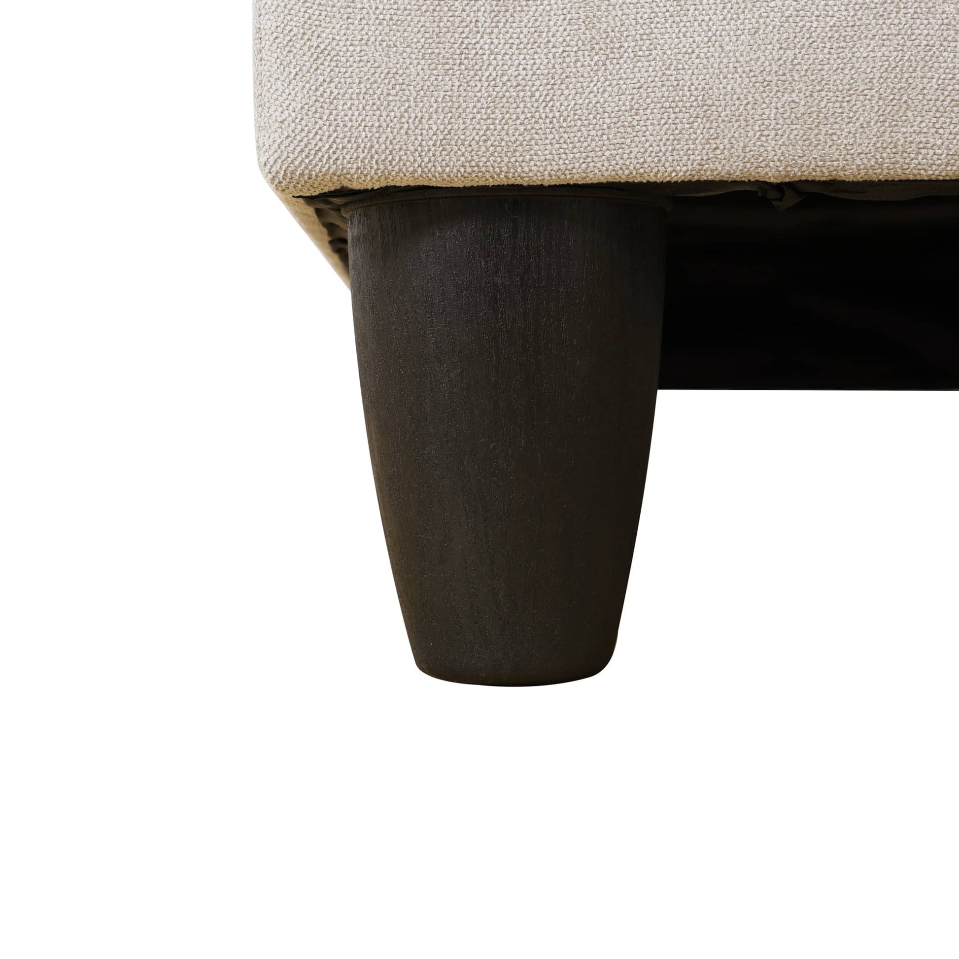 Dark wood sofa leg with light gray upholstered fabric seat