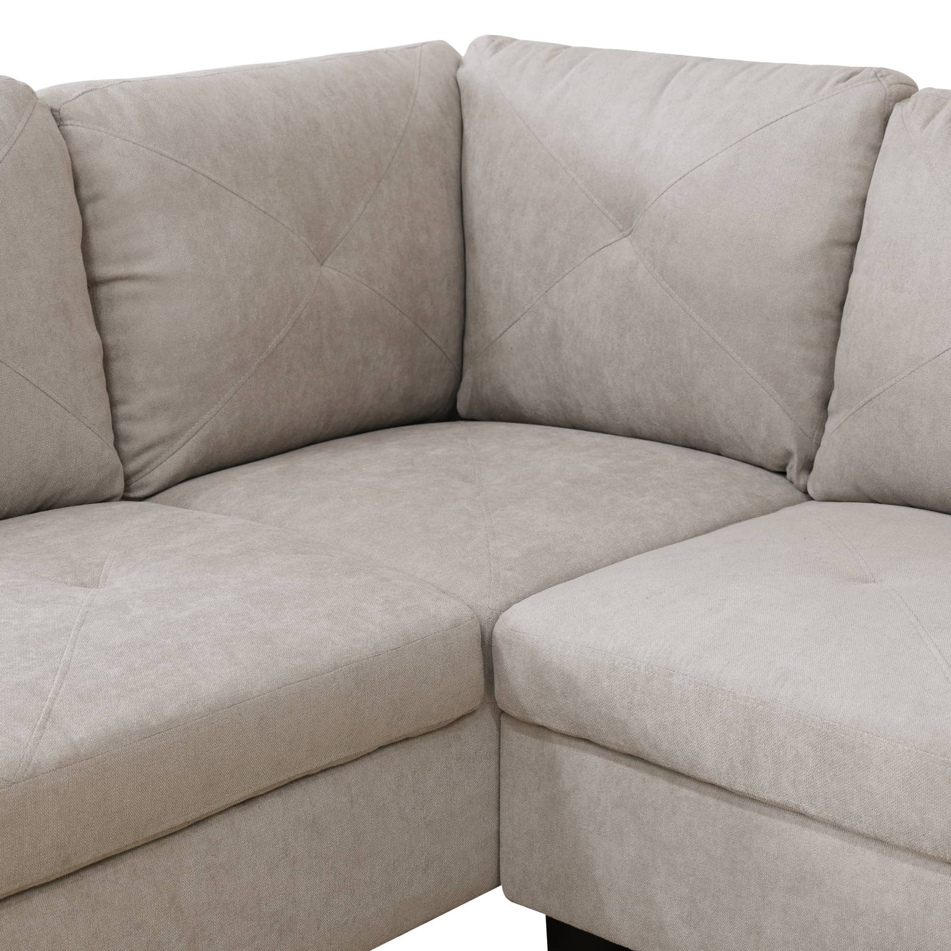 Beige fabric sectional sofa with tufted diamond pattern back cushions