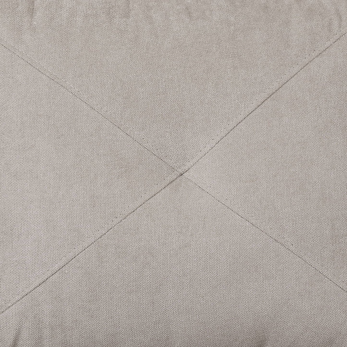 Closeup of beige woven fabric with diamond stitching