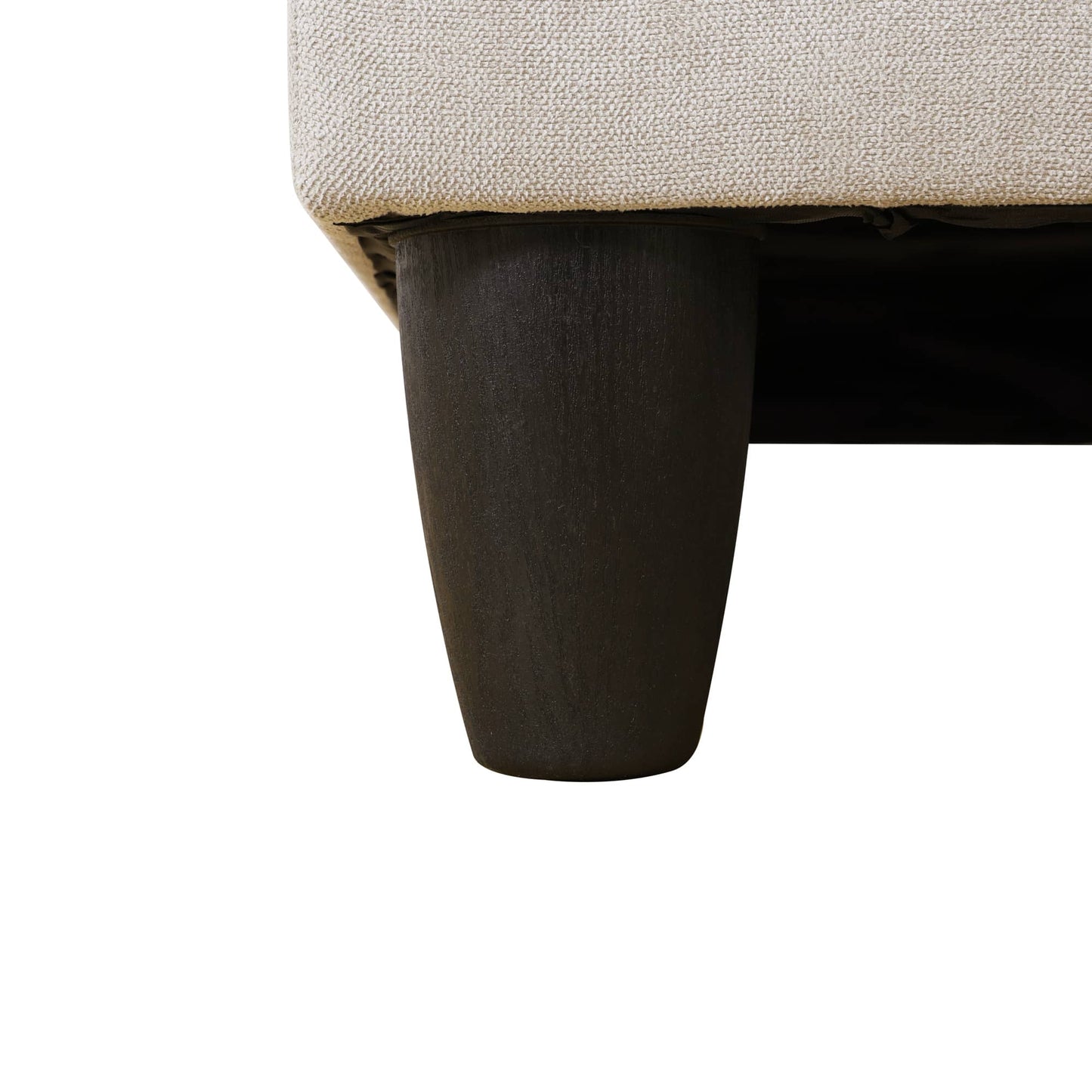 Beige textured sofa cushion with dark tapered leg