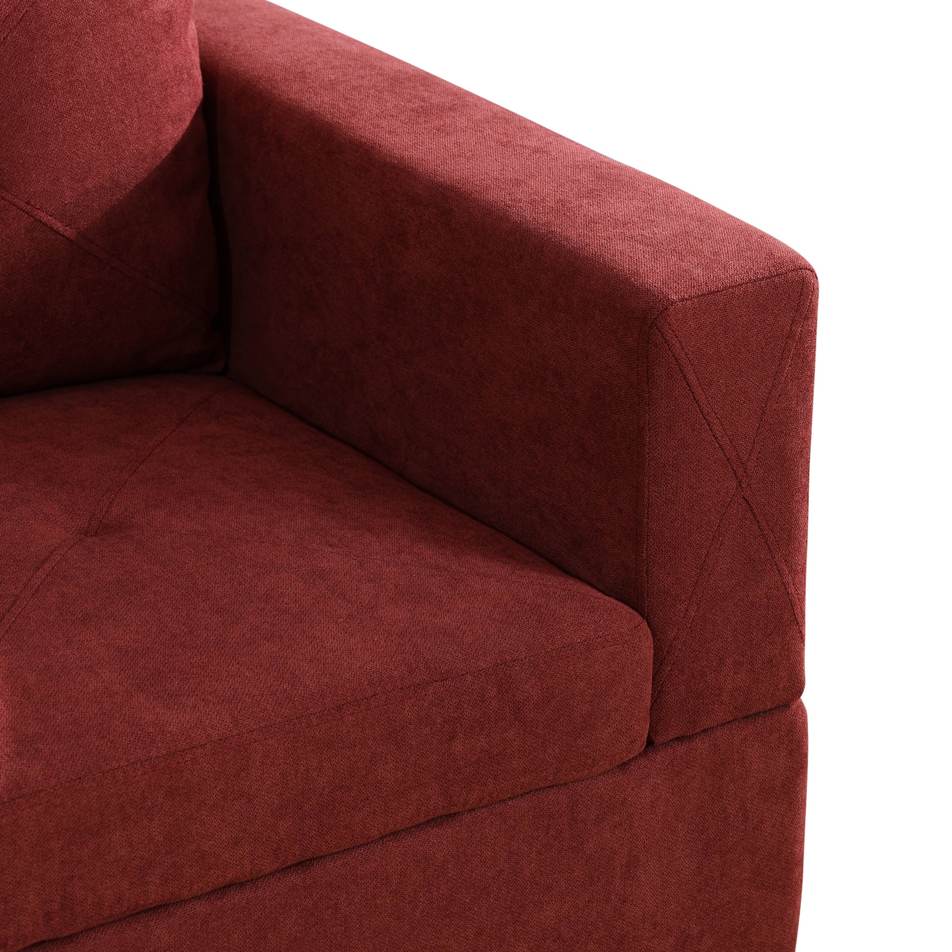 Maroon textured fabric sofa armrest with detailed stitching