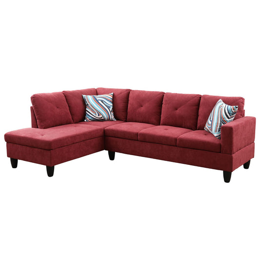 Maroon fabric sectional sofa with tufted back cushions and abstract patterned throw pillows
