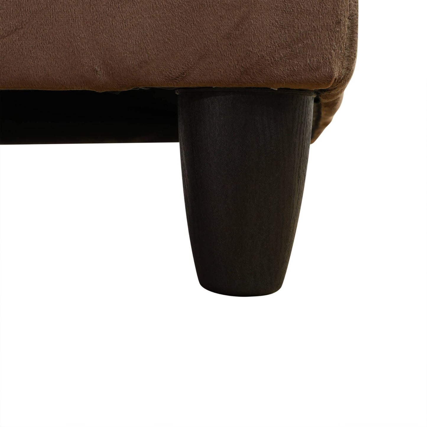 Brown suede sofa with dark tapered furniture leg