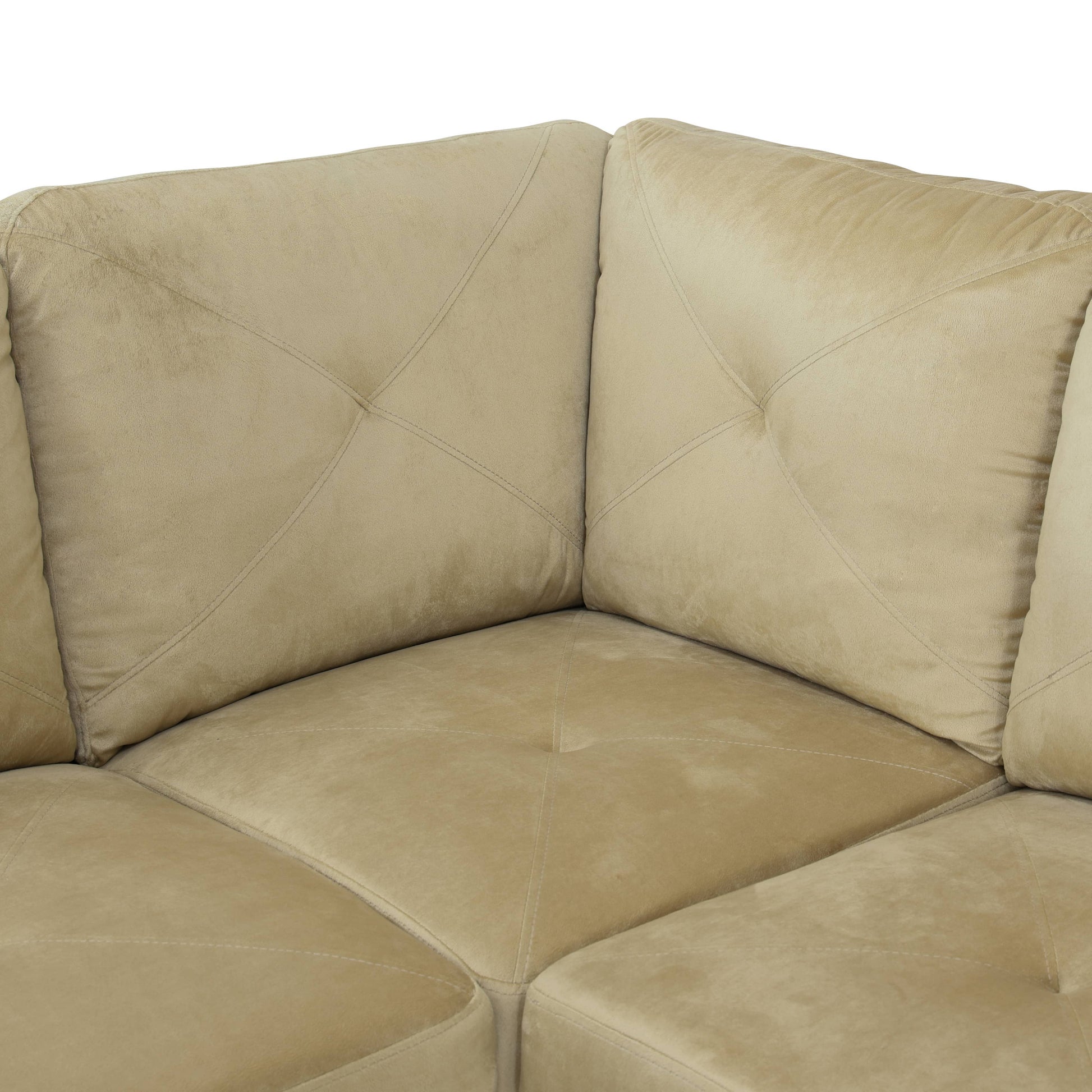 Beige velvet sectional sofa corner with tufted cushions and diamond stitching