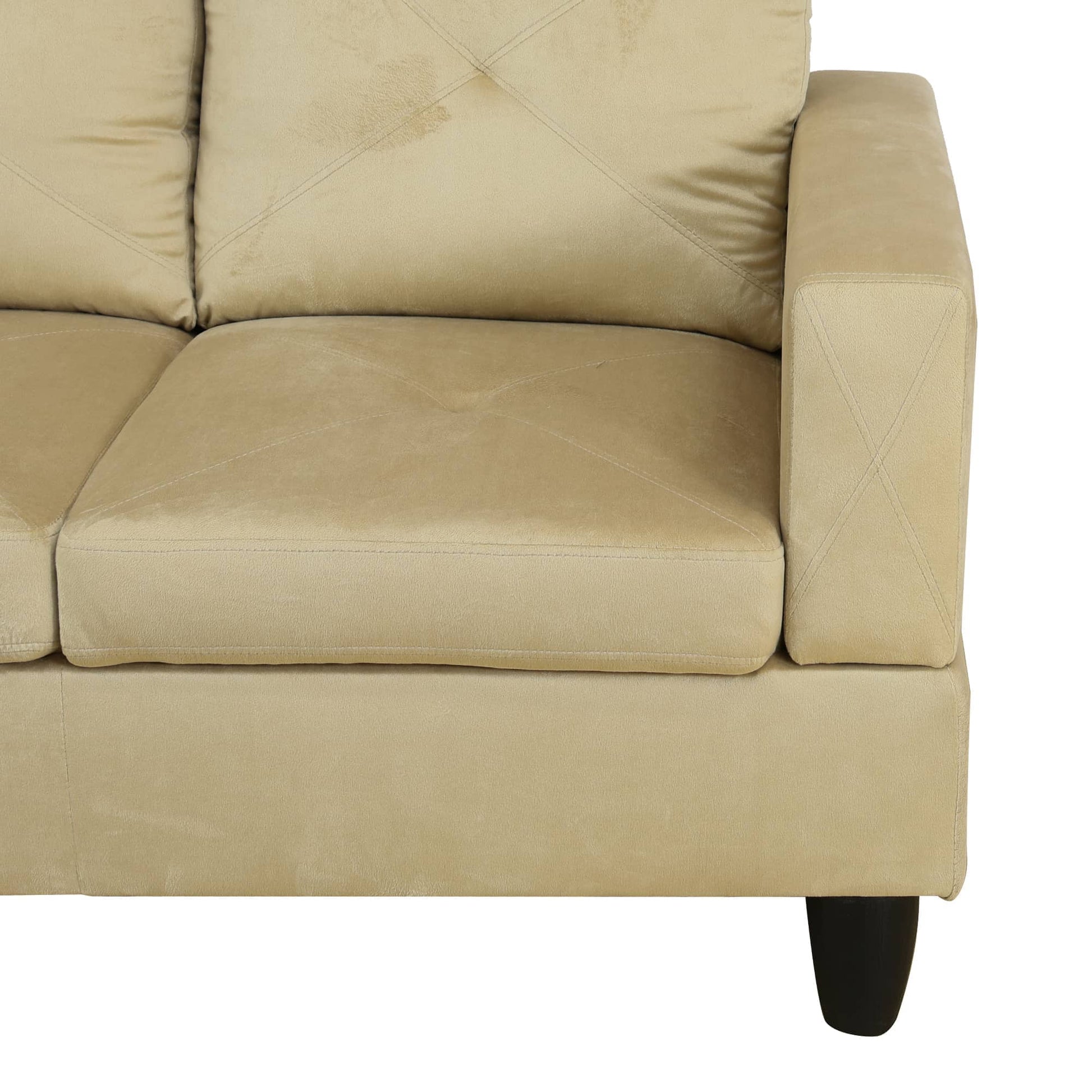 Beige velvet sofa with tufted back cushions and diamond stitching detail