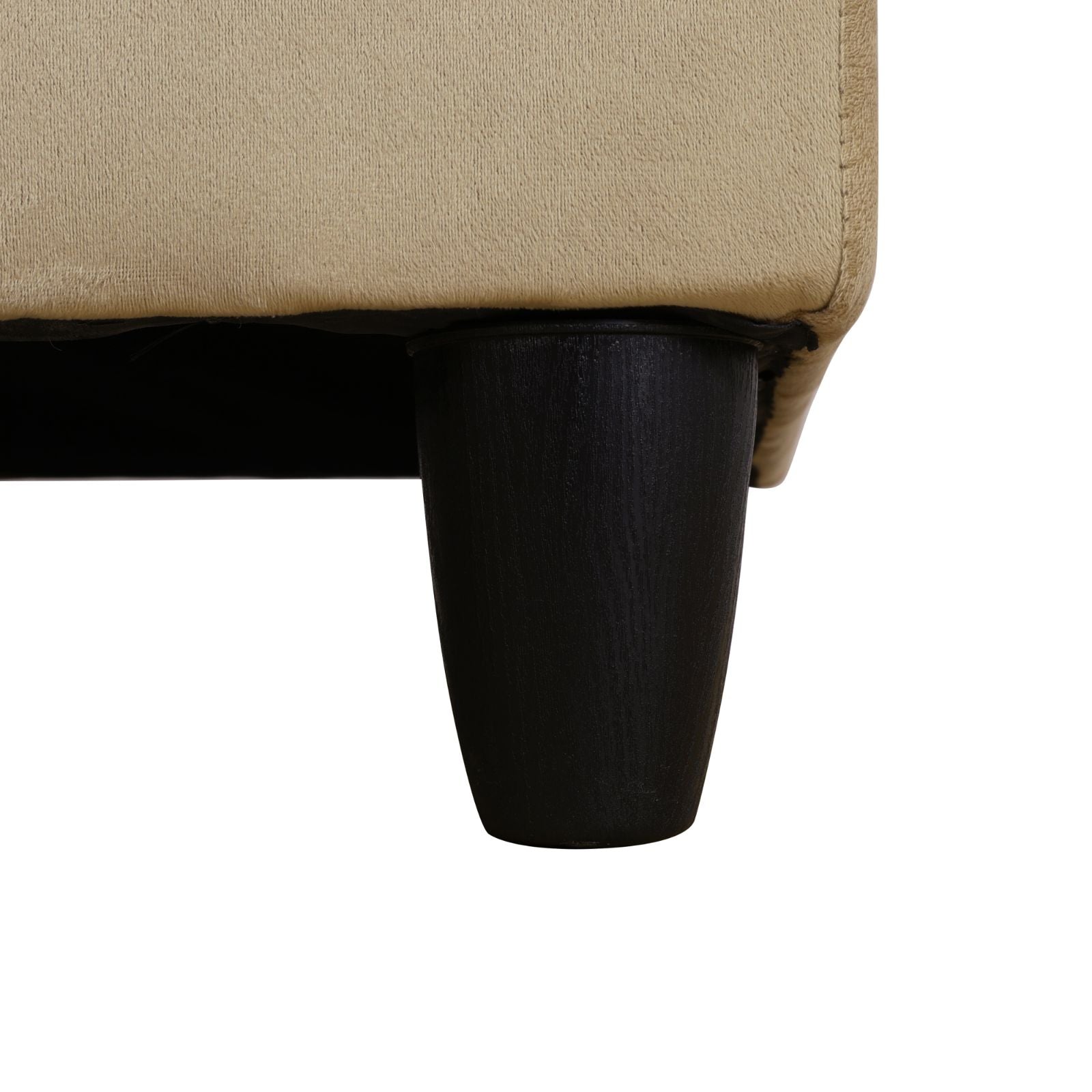 Beige textured sofa fabric detail with dark tapered wooden leg