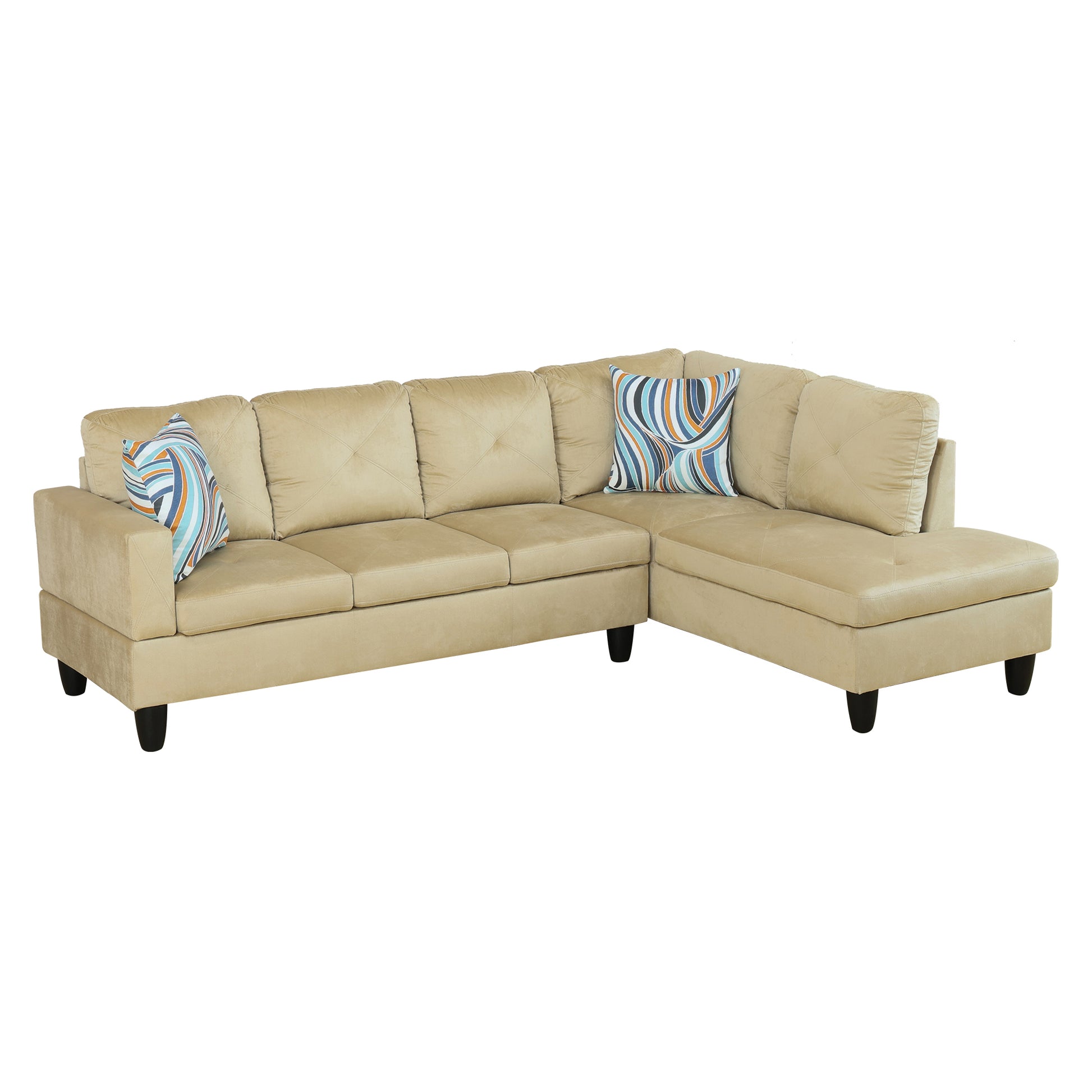 Tan velvet sectional sofa with tufted cushions and abstract pillows