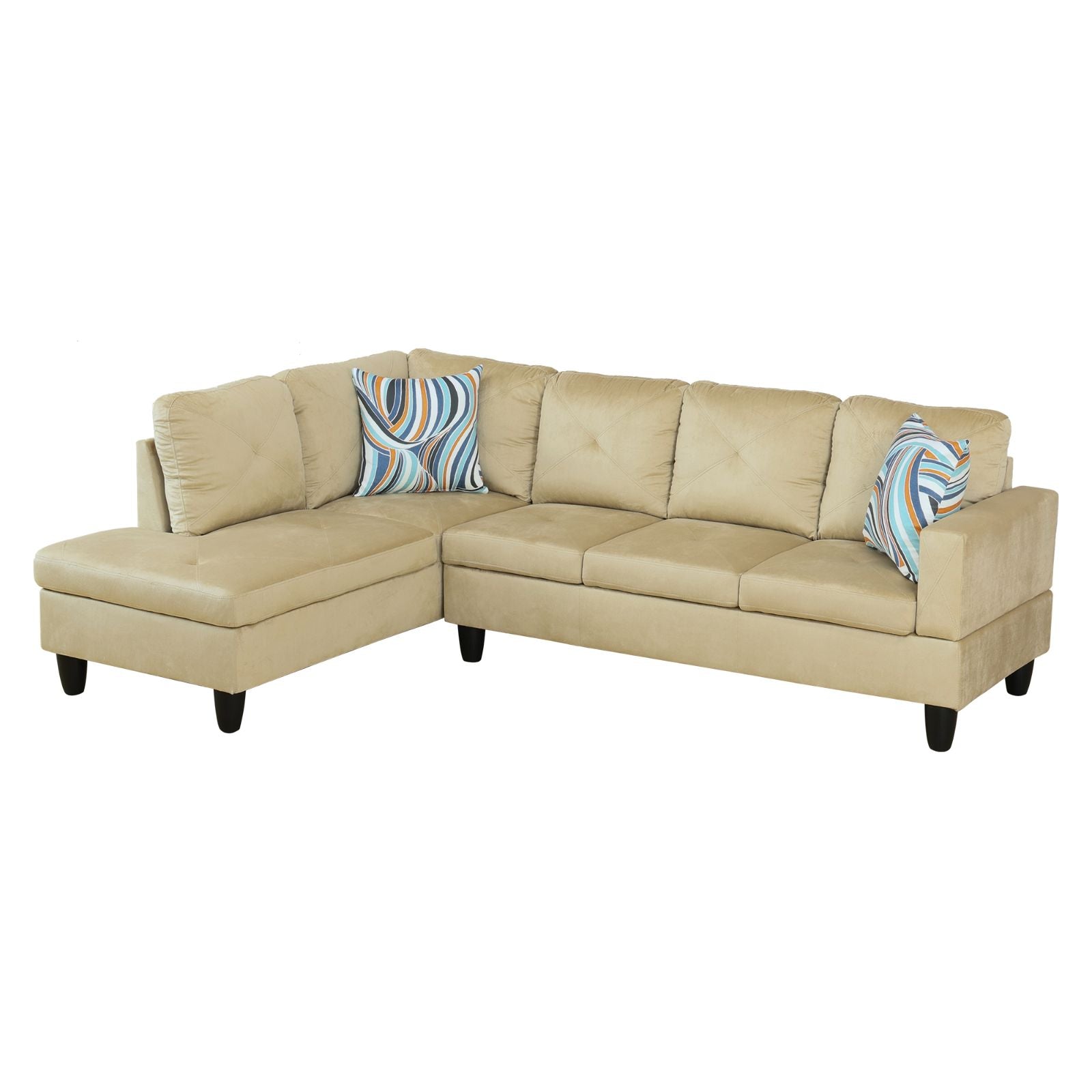 Beige velvet sectional sofa with patterned throw pillows