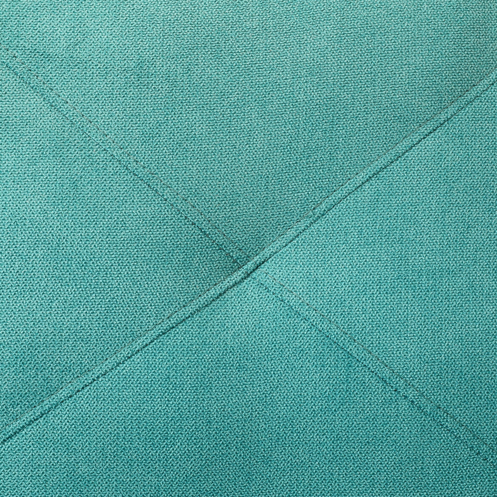 Teal textured fabric with decorative diamond stitching detail