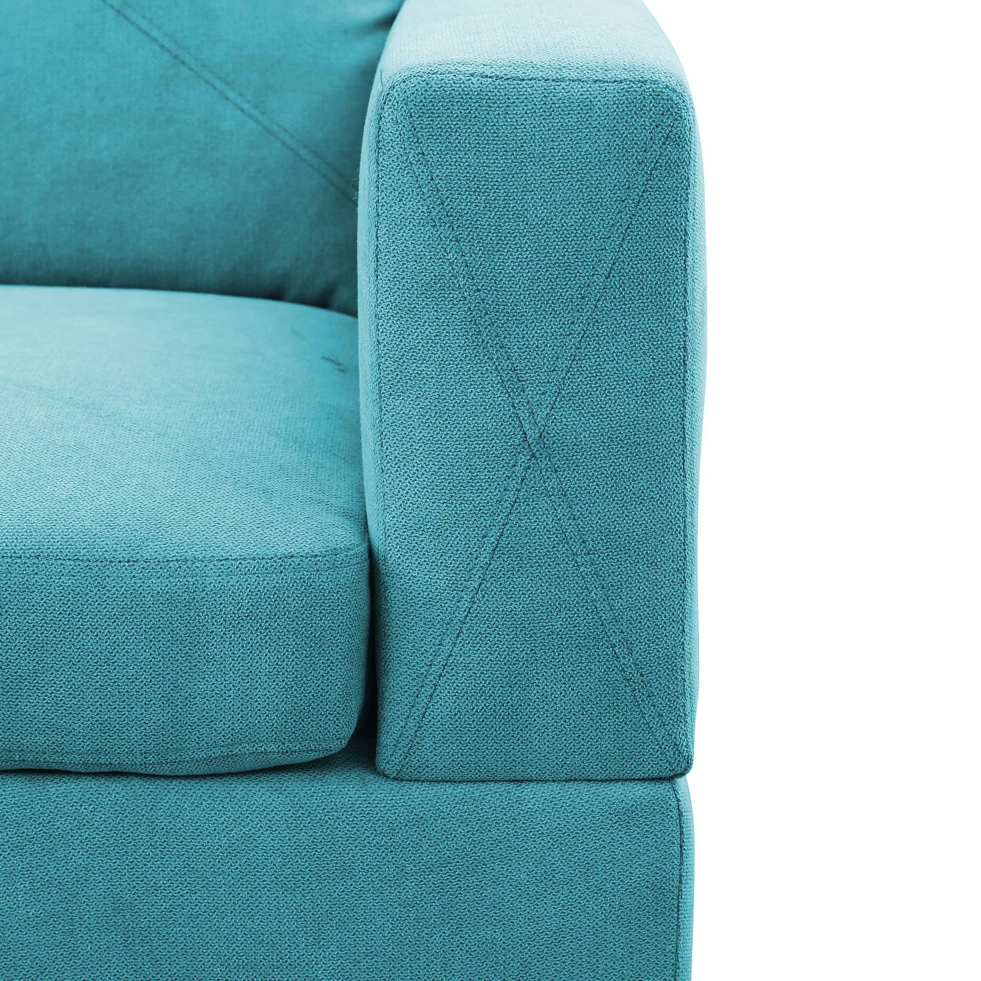 Teal fabric sofa armrest with detailed stitching