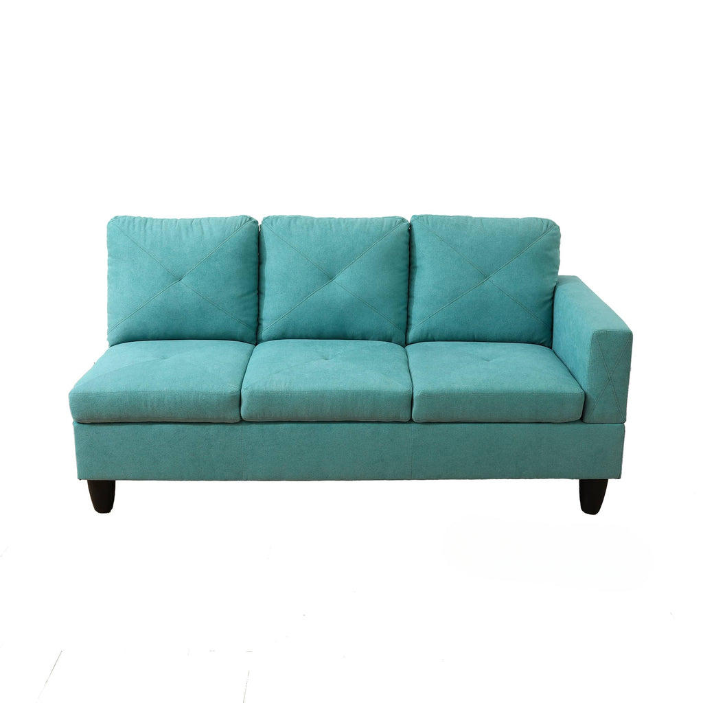 Teal sectional sofa with three tufted seat cushions and diamondstitched back pillows