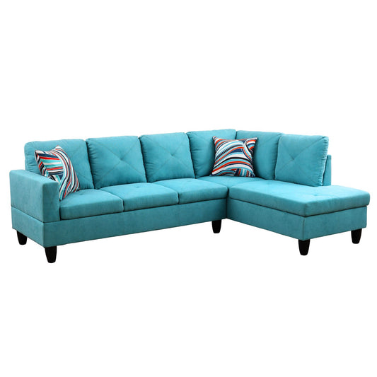 Turquoise fabric sectional sofa with diamondtufted back cushions and striped throw pillows