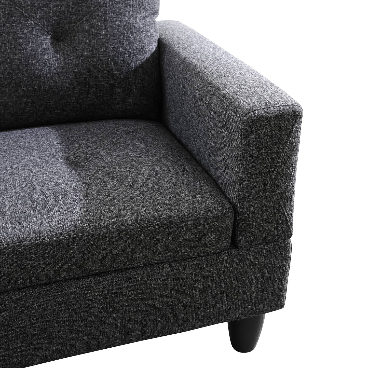 Dark gray fabric sofa with tufted backrest and modern armrest