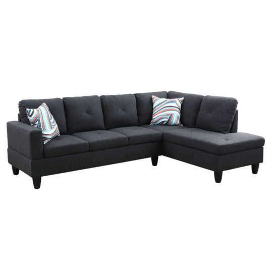 Dark grey fabric sectional sofa with striped accent pillows