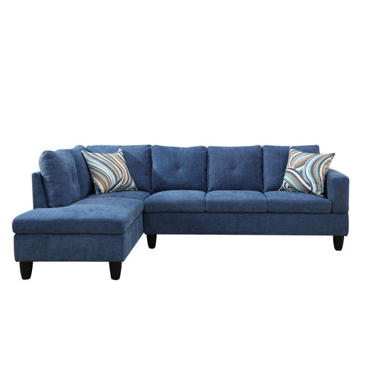 Blue fabric sectional sofa with tufted back cushions and decorative pillows