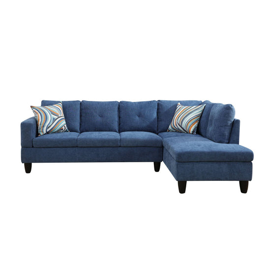 Deep blue fabric sectional sofa with modern tufted cushions and decorative pillows