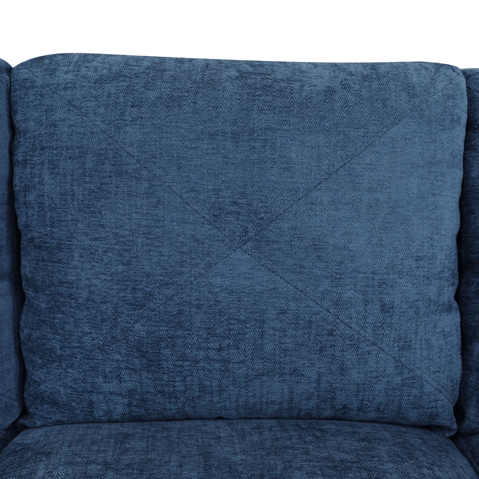 Deep blue velvet armchair cushion with subtle chevron pattern and diamond stitching