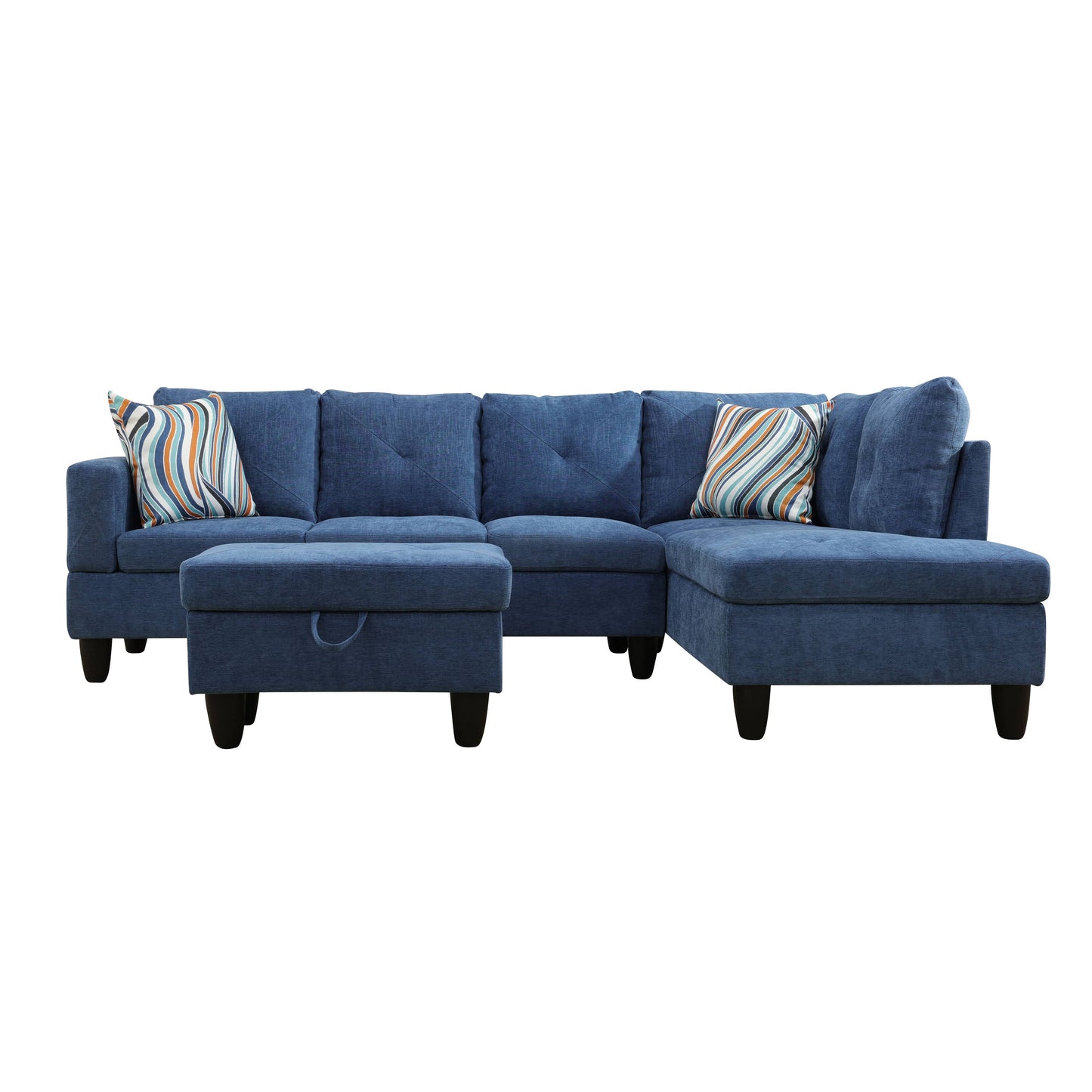 Deep blue fabric sectional sofa with two patterned throw pillows and ottoman