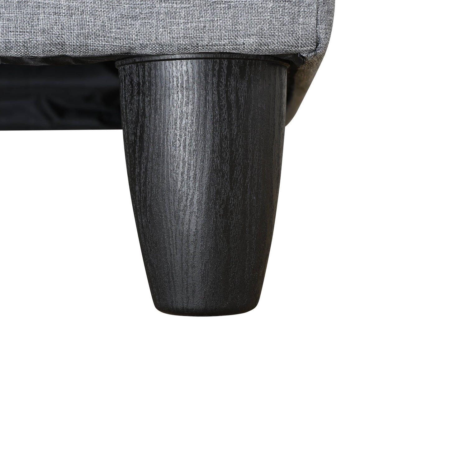 Textured gray fabric sofa detail with tapered black wood leg