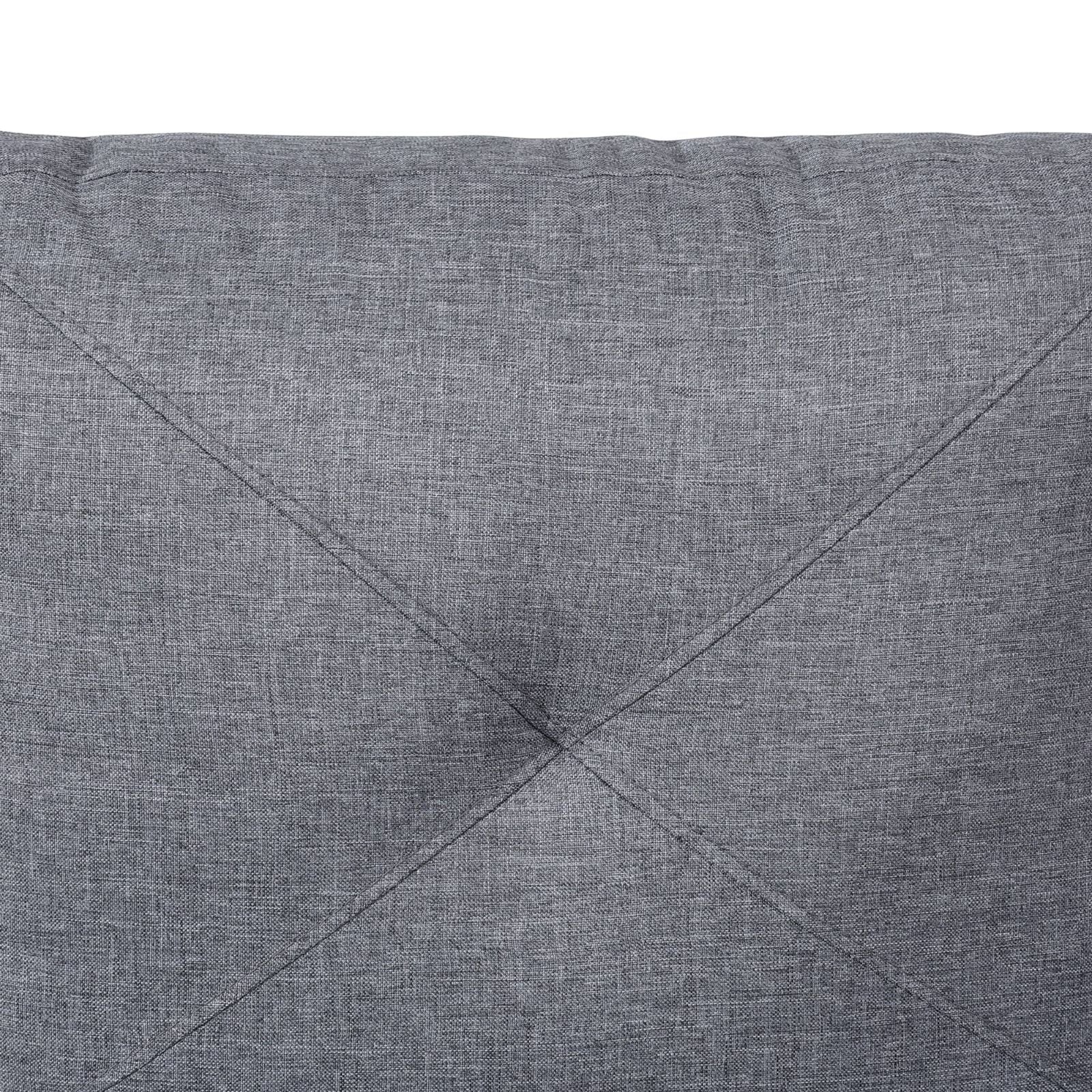 Closeup of textured grey fabric with diamond stitching detail