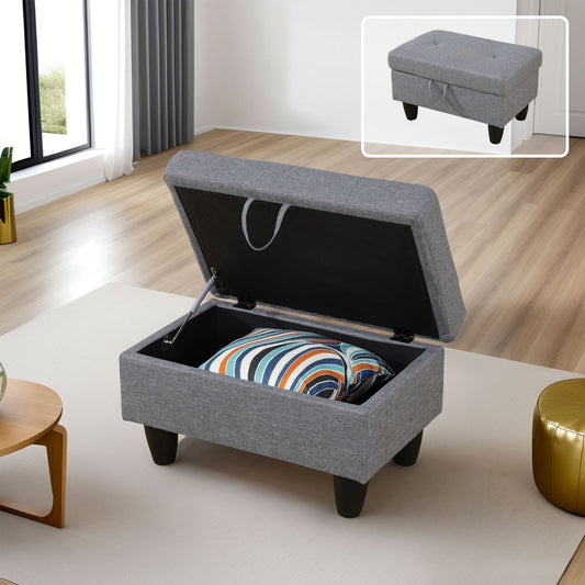 Grey fabric storage ottoman with open lid revealing colorful striped pillow