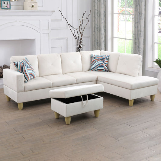 White velvet sectional sofa with patterned pillows and open storage ottoman