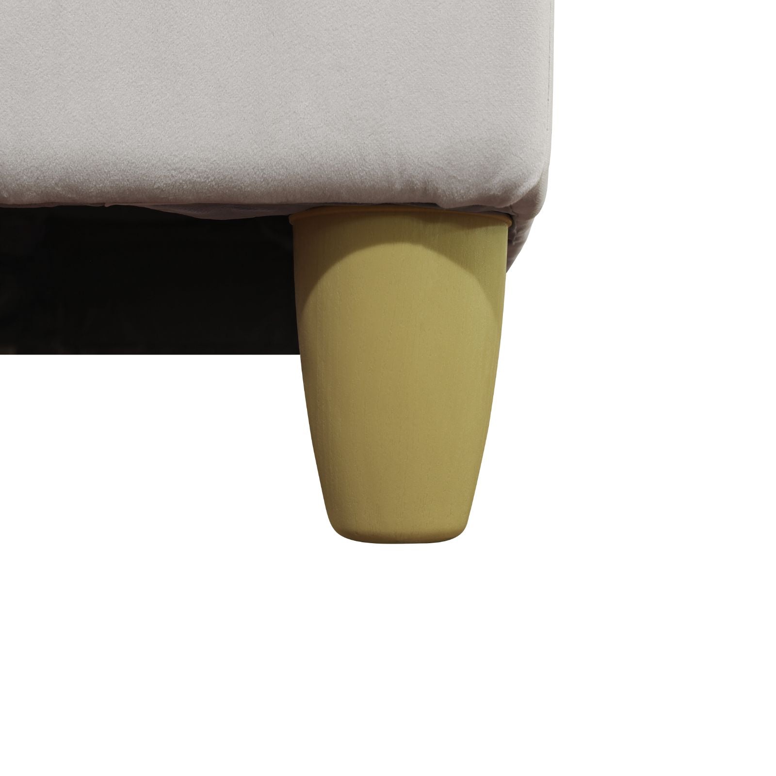 Beige fabric sofa with a single gold tapered leg