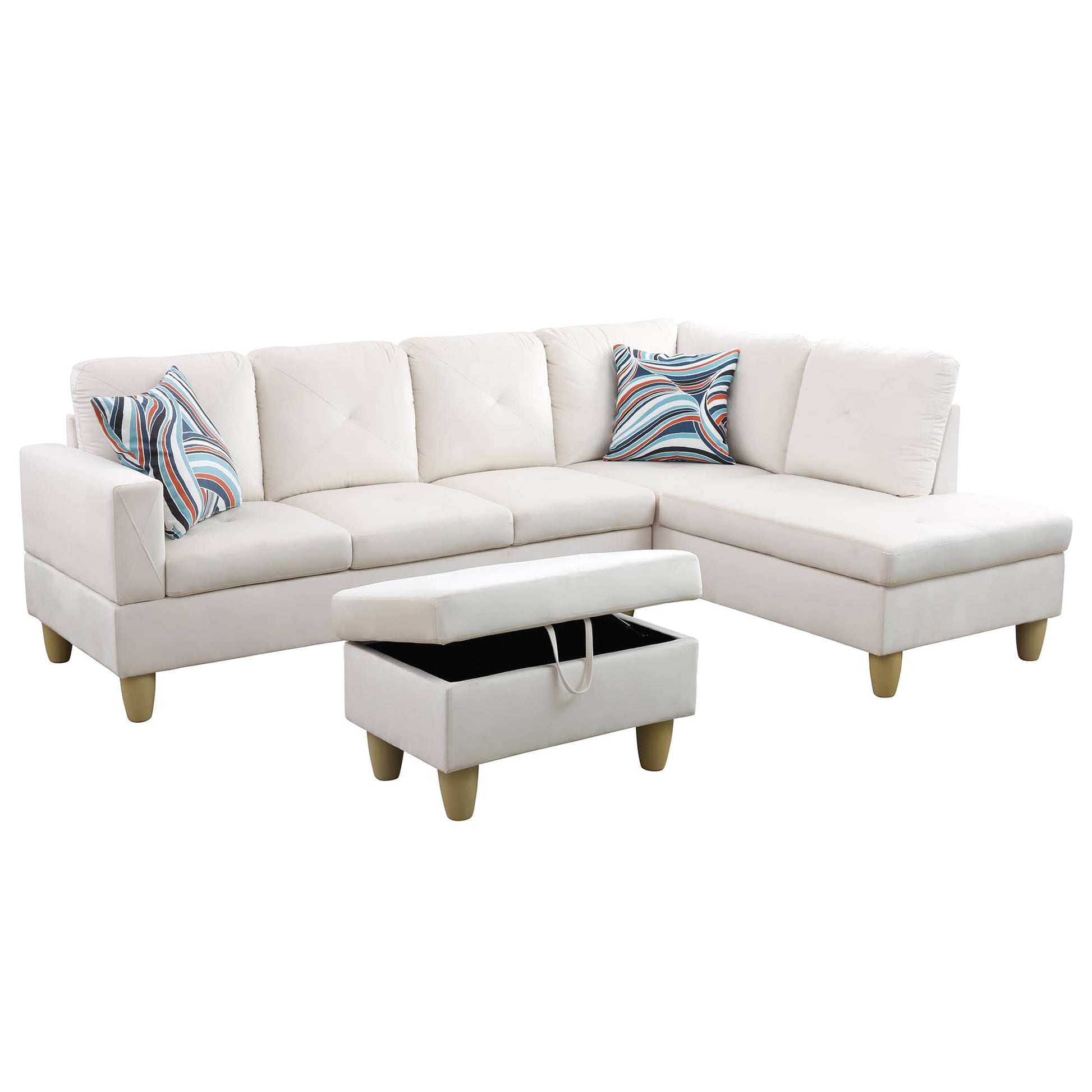 White sectional sofa with patterned accent pillows and open storage ottoman