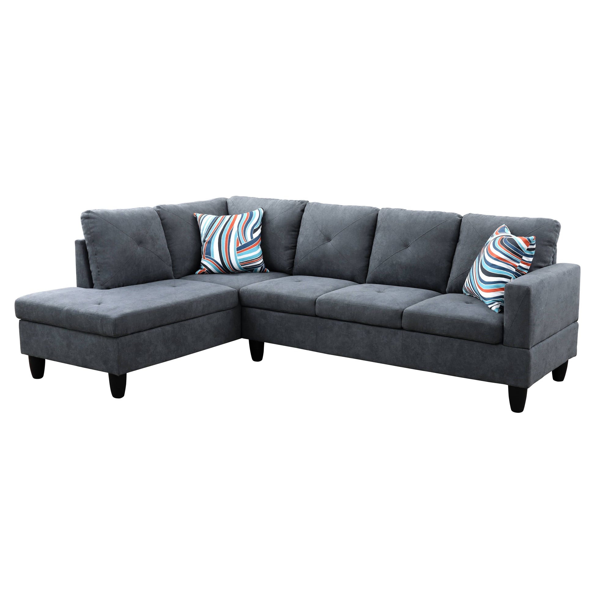 Dark gray fabric sectional sofa with tufted cushions and two striped accent pillows