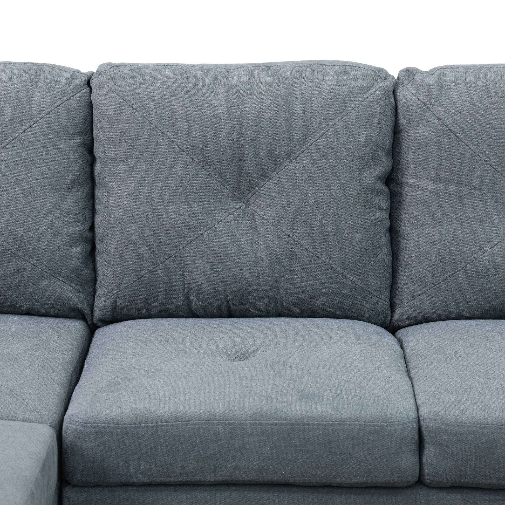 Textured grey fabric sofa cushions with diamond stitching
