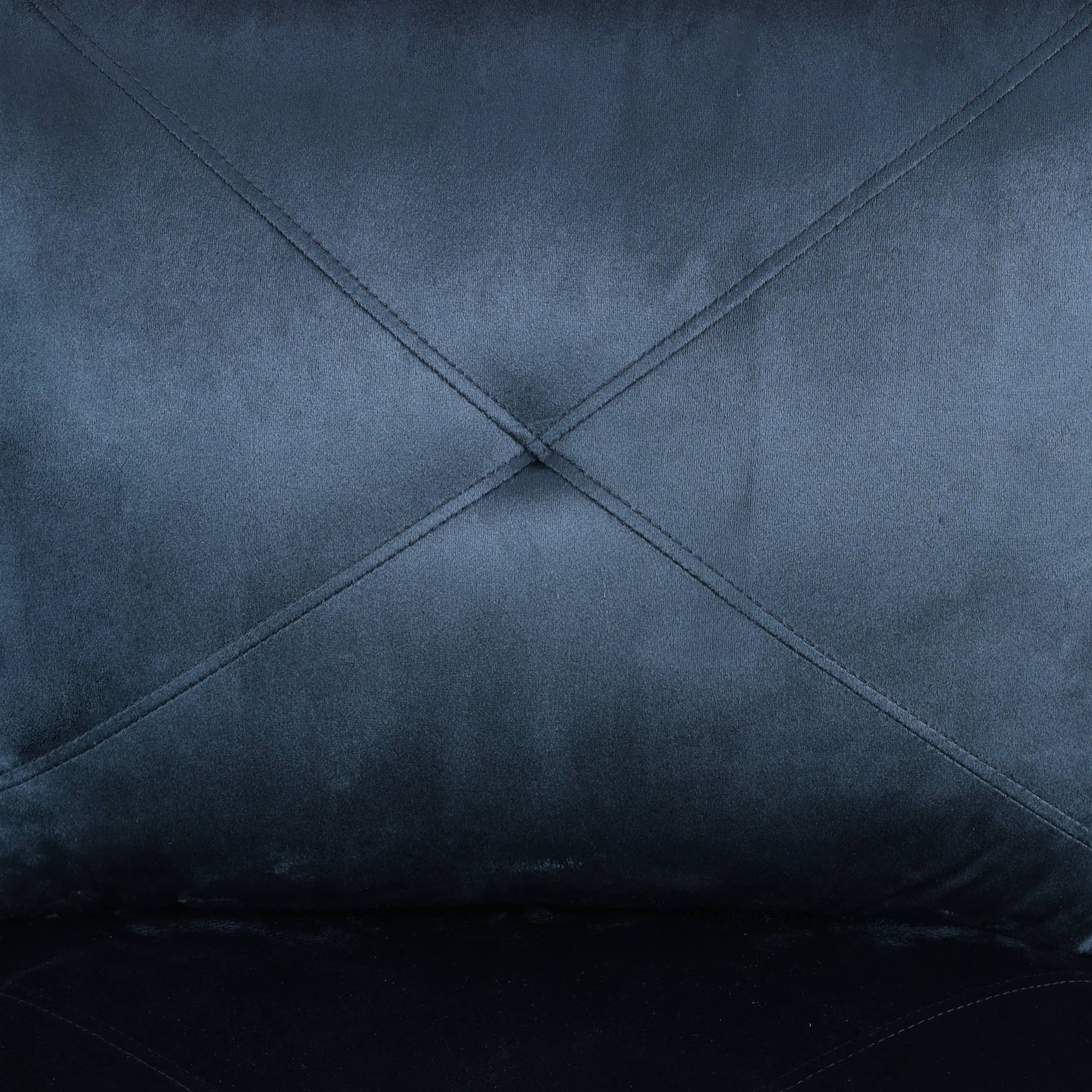 Dark blue velvet fabric with diamond tufted stitching detail