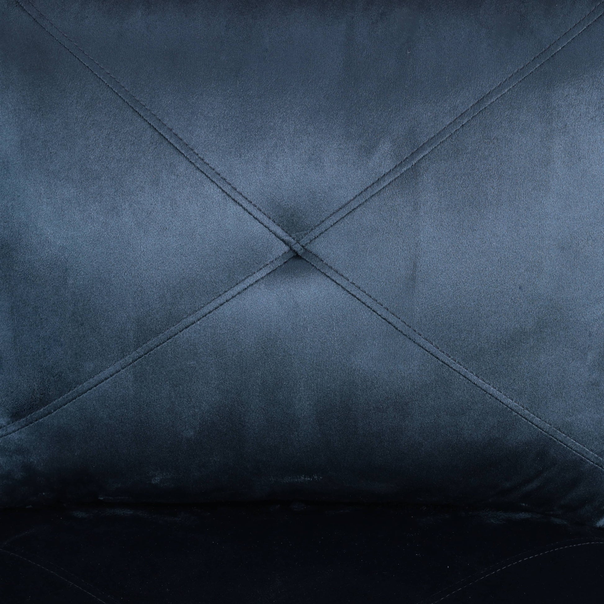 Dark blue velvet fabric with diamond tufted stitching detail