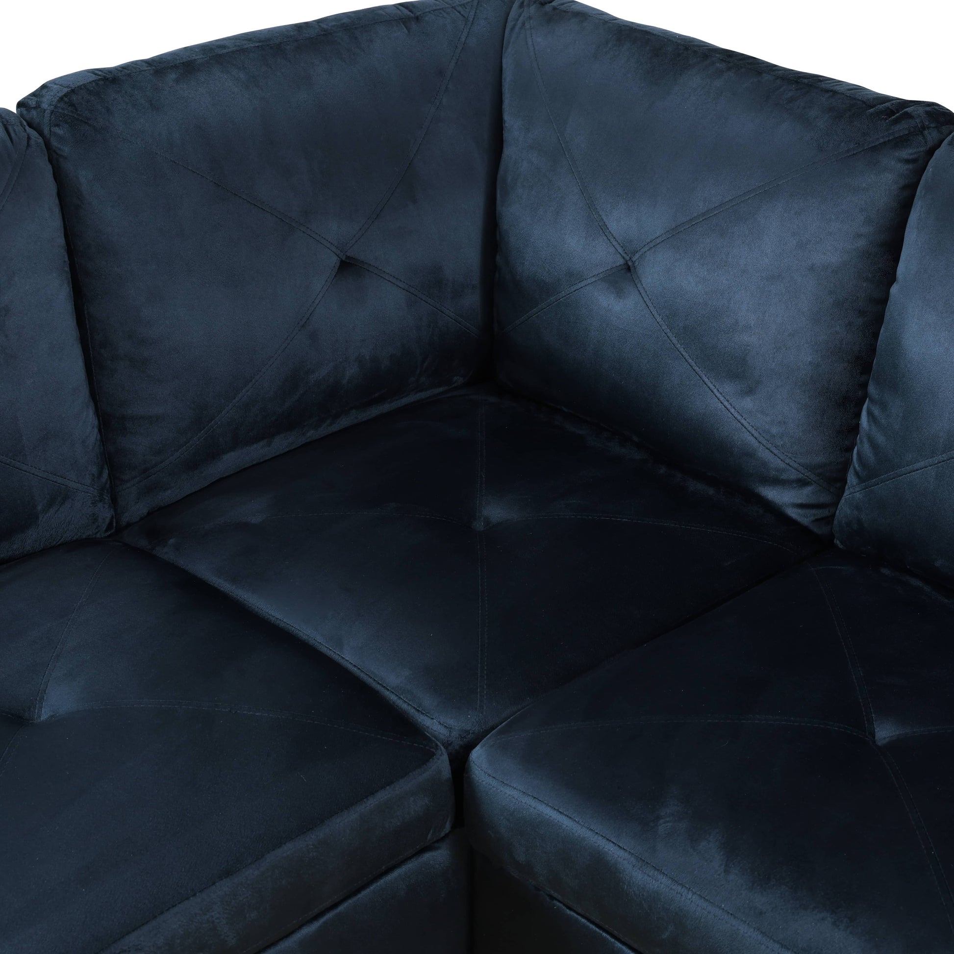 Deep navy blue velvet sectional sofa with tufted diamond pattern