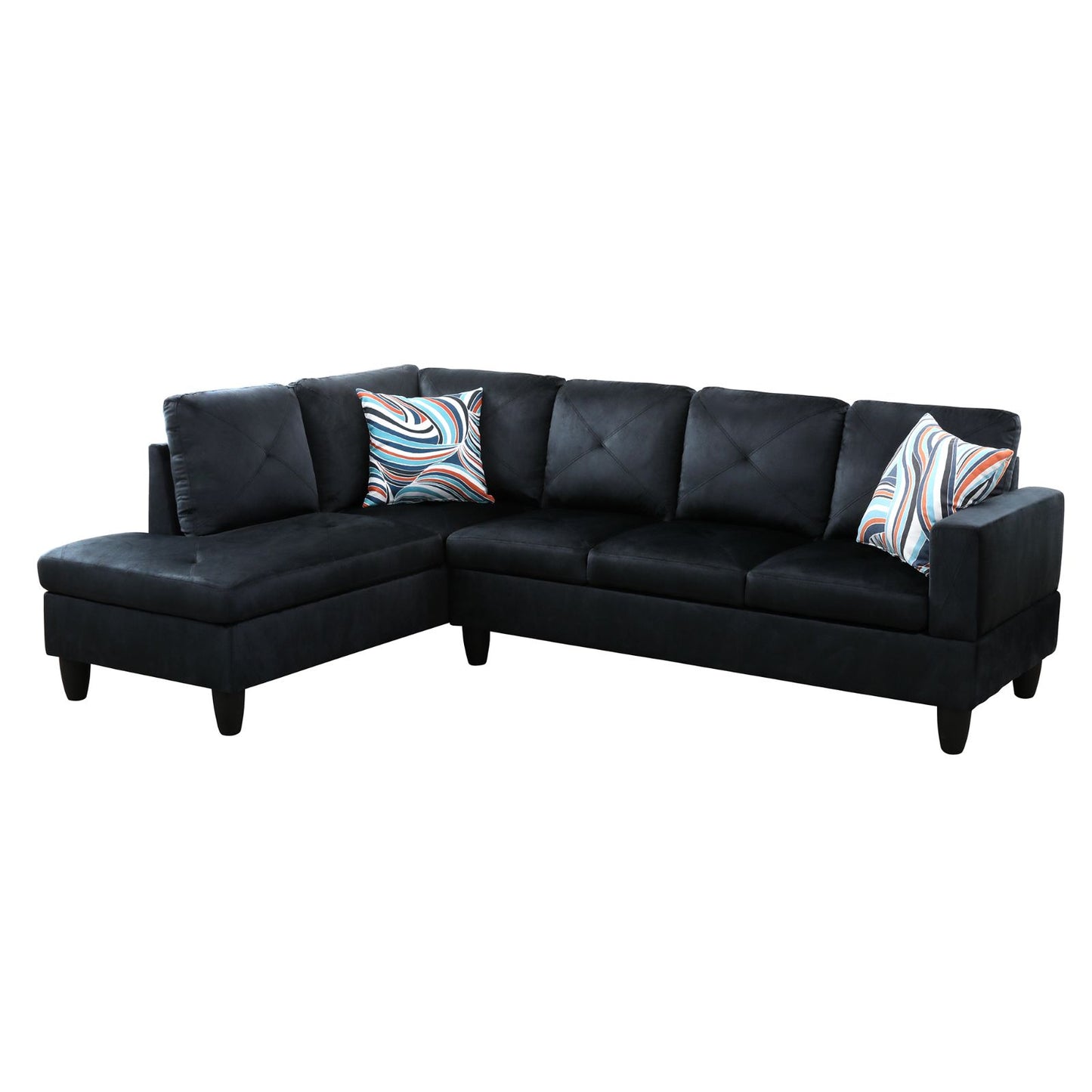 Black velvet sectional sofa with tufted cushions and patterned accent pillows