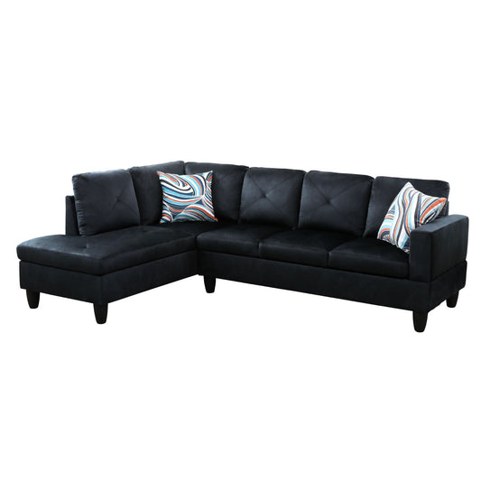 Black velvet sectional sofa with tufted cushions and patterned accent pillows