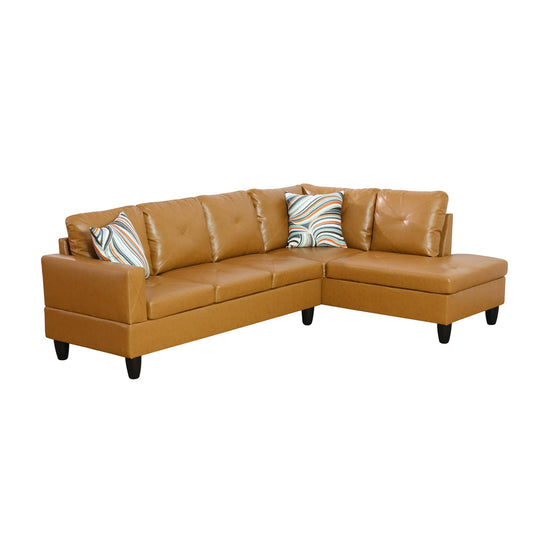 Tan faux leather Lshaped sectional sofa with tufted cushions and geometric accent pillows