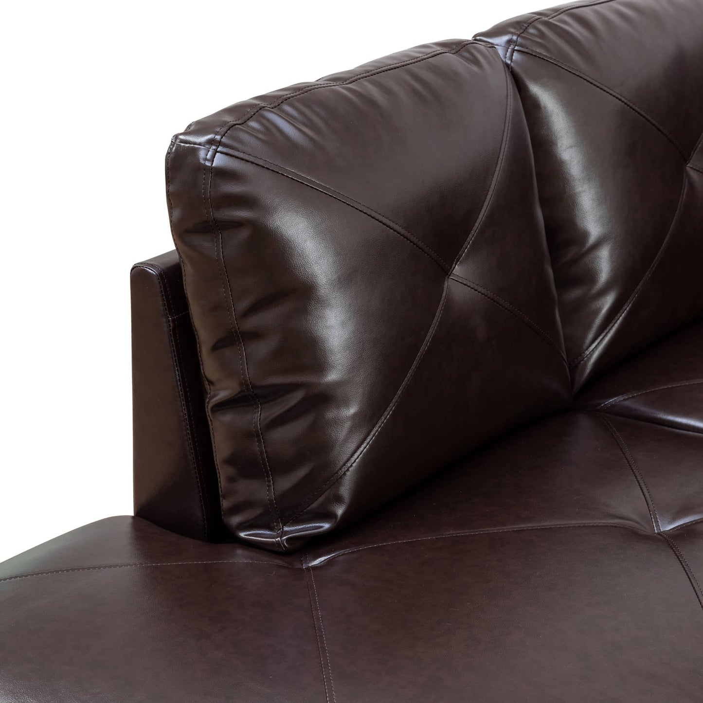 Closeup of a dark brown faux leather sofa with diamond stitching