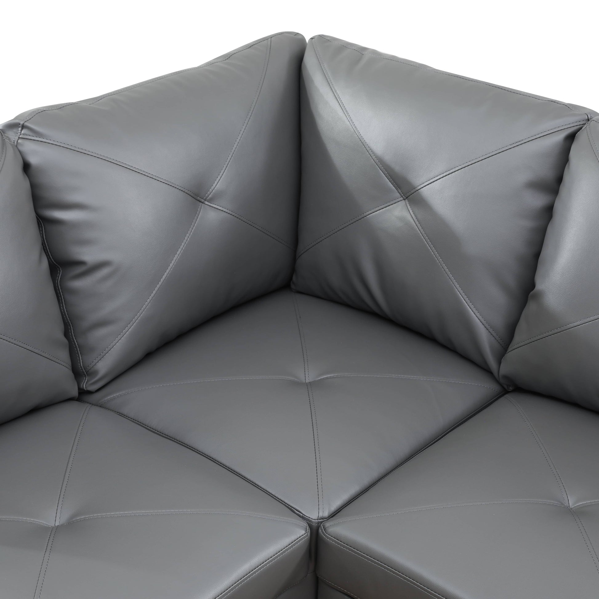Gray leather sectional sofa corner with diamond tufted cushions