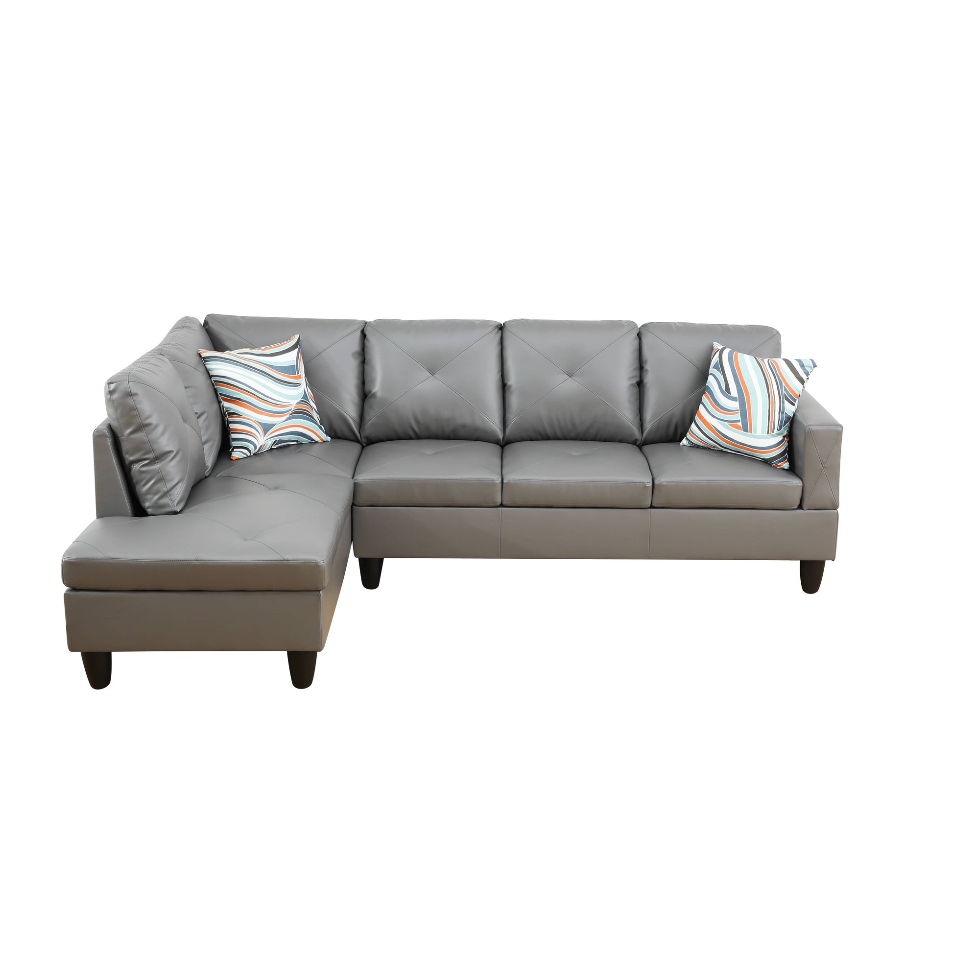 Gray faux leather sectional sofa with diamond tufted cushions and patterned accent pillows