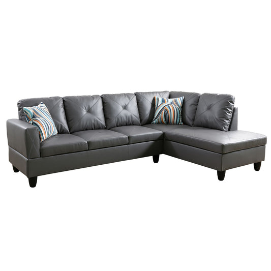 Gray faux leather sectional sofa with tufted cushions and striped throw pillows