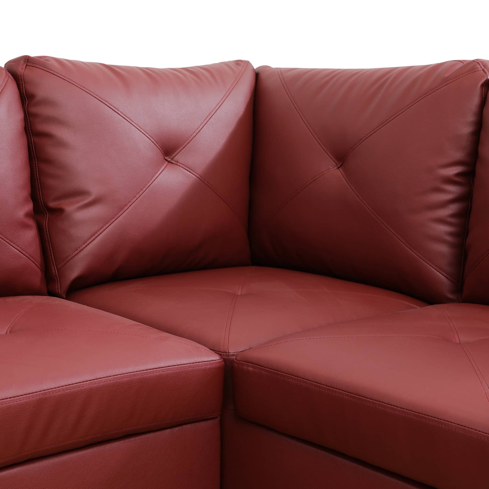 Red leather sectional sofa with diamond tufting and contrast stitching
